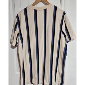 XL No Boundaries Beige shirt with‎ multicolor stripes.